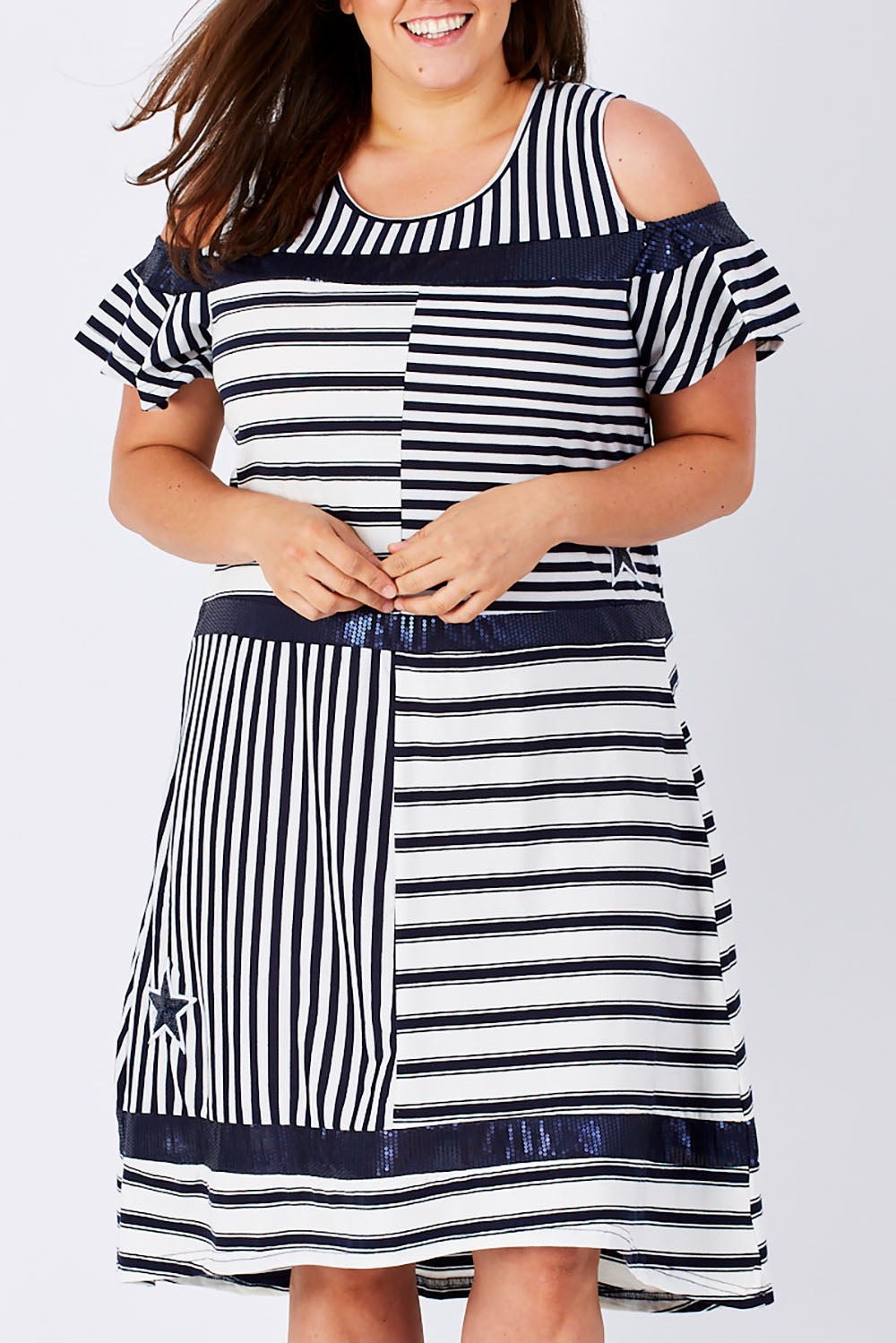 Model Mae wearing size XXL of the Star Stripe Dress in colour NavyWhite (Blue), from the front, cropped image