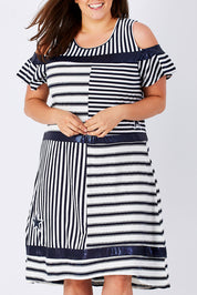 Model Mae wearing size XXL of the Star Stripe Dress in colour NavyWhite (Blue), from the front, cropped image