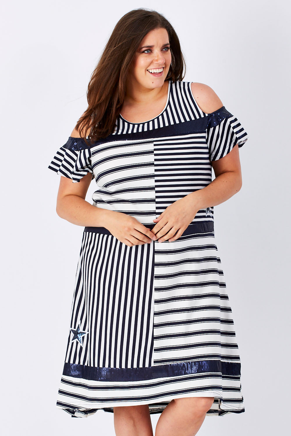 Model Mae wearing size XXL of the Star Stripe Dress in colour NavyWhite (Blue), from the front, cropped image