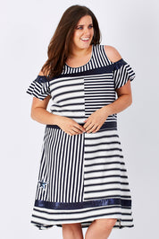 Model Mae wearing size XXL of the Star Stripe Dress in colour NavyWhite (Blue), from the front, cropped image