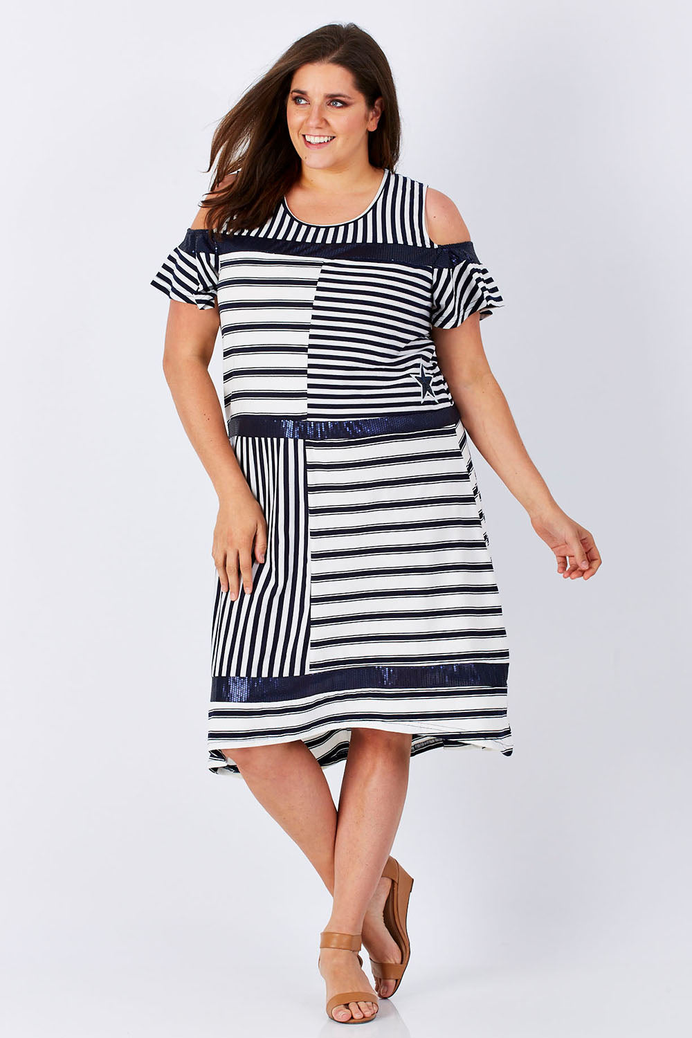 Model Mae wearing size XXL of the Star Stripe Dress in colour NavyWhite (Blue), from the front, showing the whole outfit