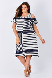 Model Mae wearing size XXL of the Star Stripe Dress in colour NavyWhite (Blue), from the front, showing the whole outfit