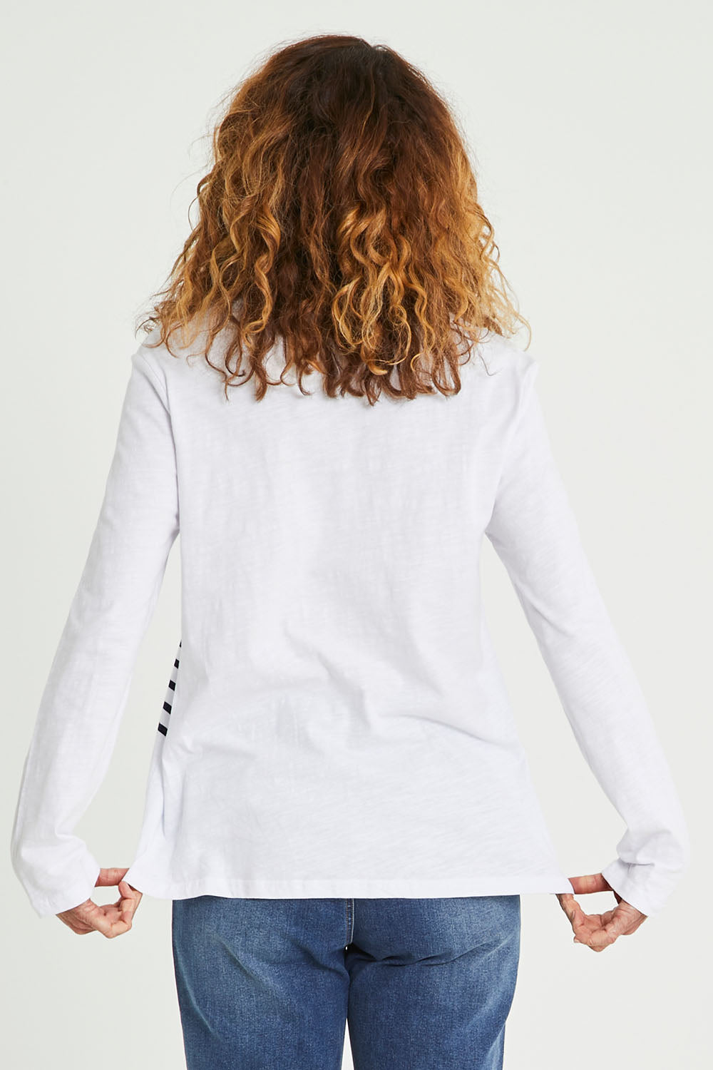 Model Emma wearing size S of the Star Stripe Tee in colour White (White), from the back