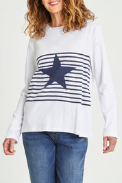 Model Emma wearing size S of the Star Stripe Tee in colour White (White), from the front, cropped image