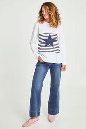 Model Emma wearing size S of the Star Stripe Tee in colour White (White), from the front, showing the whole outfit