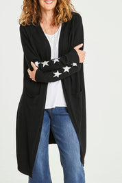 Model Emma wearing size S of the Longline Cardi in colour Black (Black), from the front, cropped image