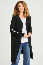 Model Emma wearing size S of the Longline Cardi in colour Black (Black), from the front, cropped image