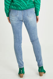 Model Emma wearing size S of the Reversible Jean in colour Denim (Blue), from the back