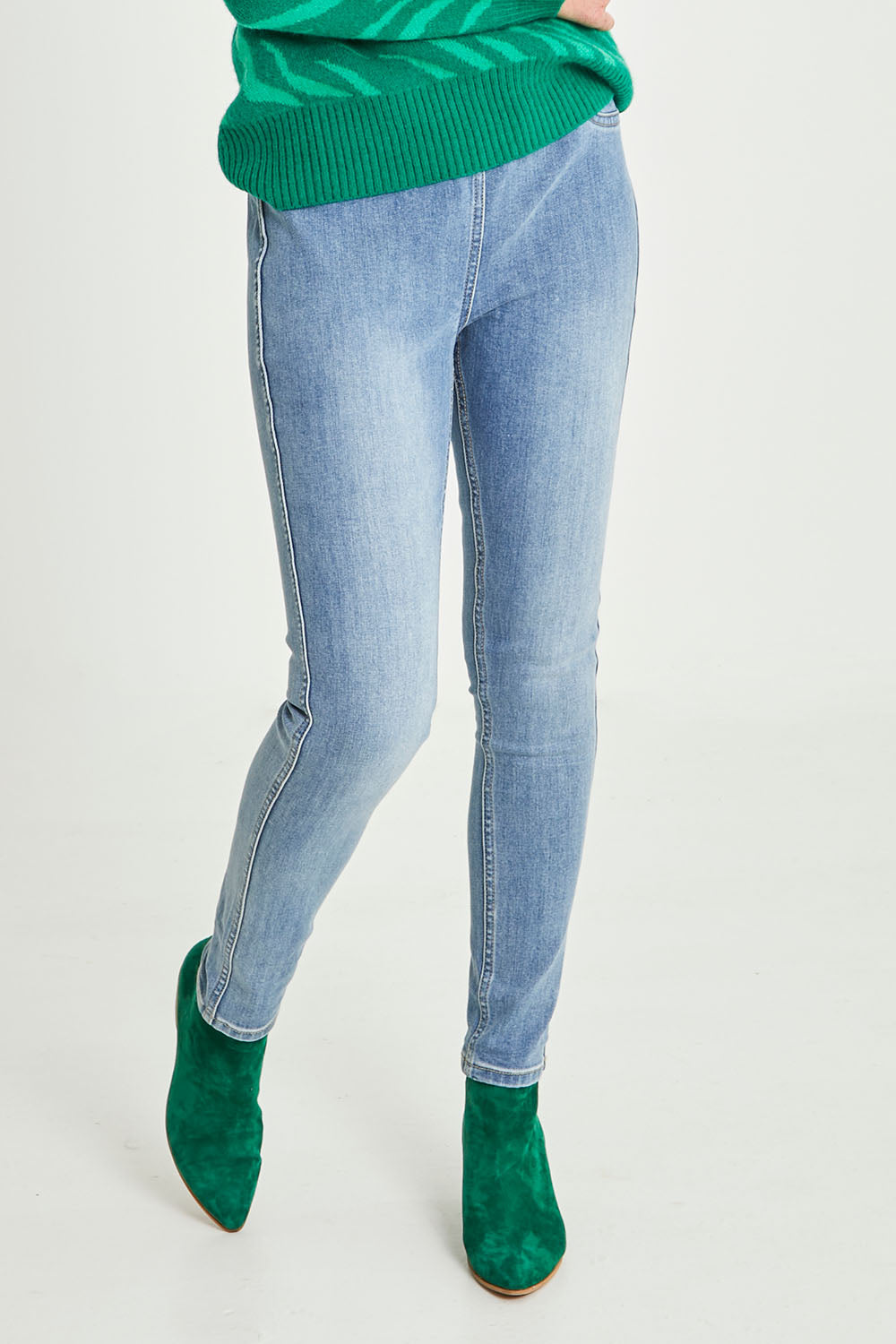 Model Emma wearing size S of the Reversible Jean in colour Denim (Blue), from the front, cropped image
