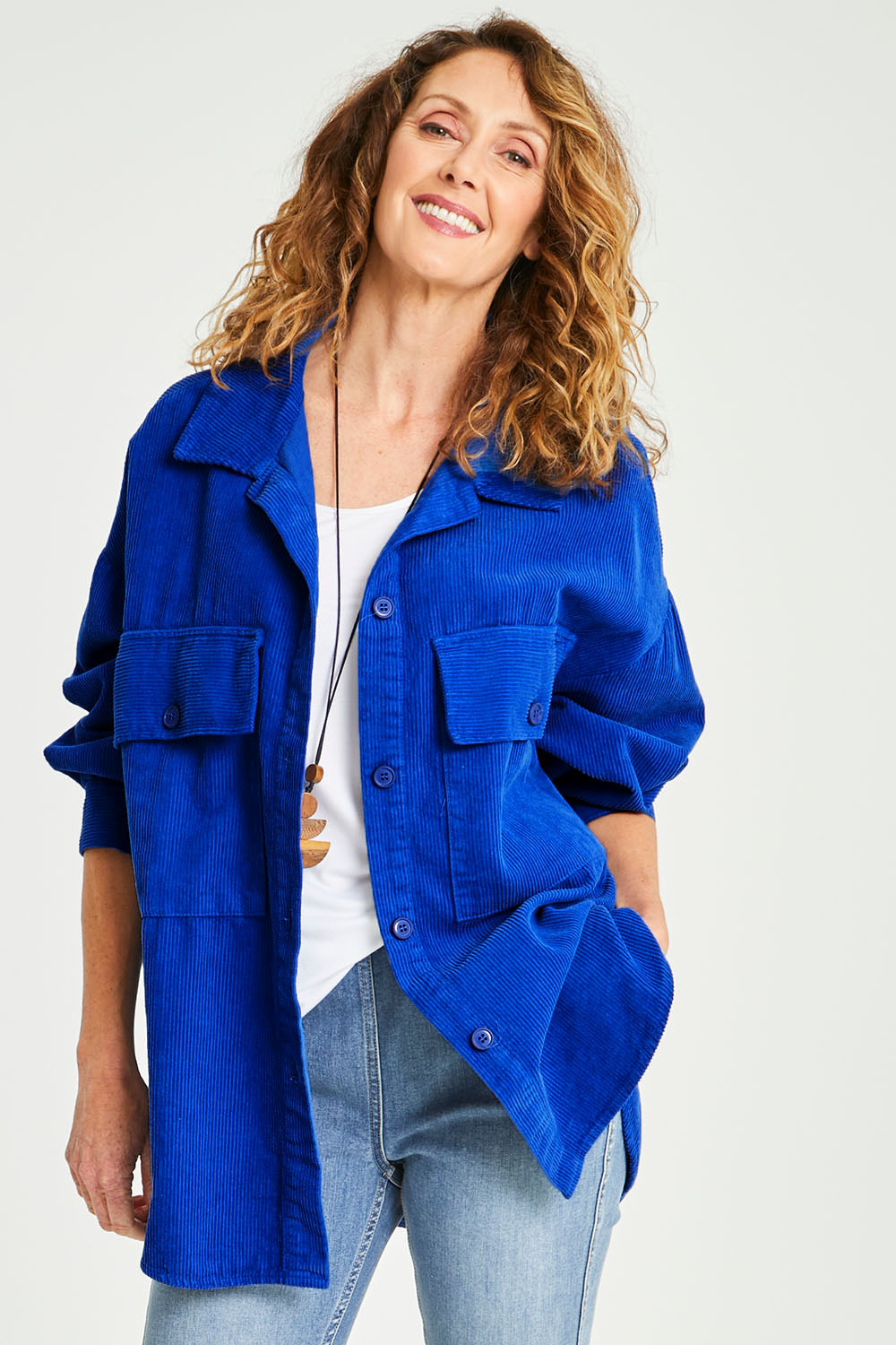 Model Emma wearing size S of the Zoe Cord Shacket in colour Cobalt (Blue), from the front, cropped image