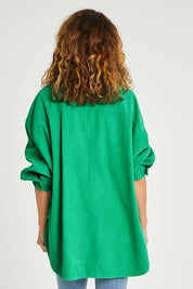 Model Emma wearing size S of the Zoe Cord Shacket in colour Jade (Green), from the back