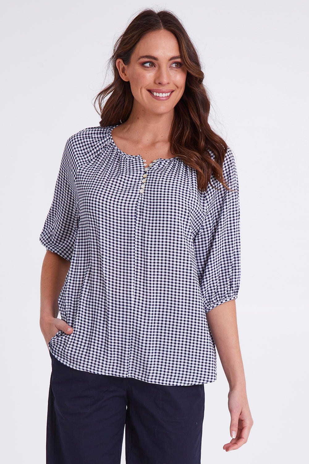 Model Madeline wearing size S of the Check It Out Top in colour Navy (Blue), from the front, cropped image