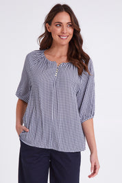 Model Madeline wearing size S of the Check It Out Top in colour Navy (Blue), from the front, cropped image
