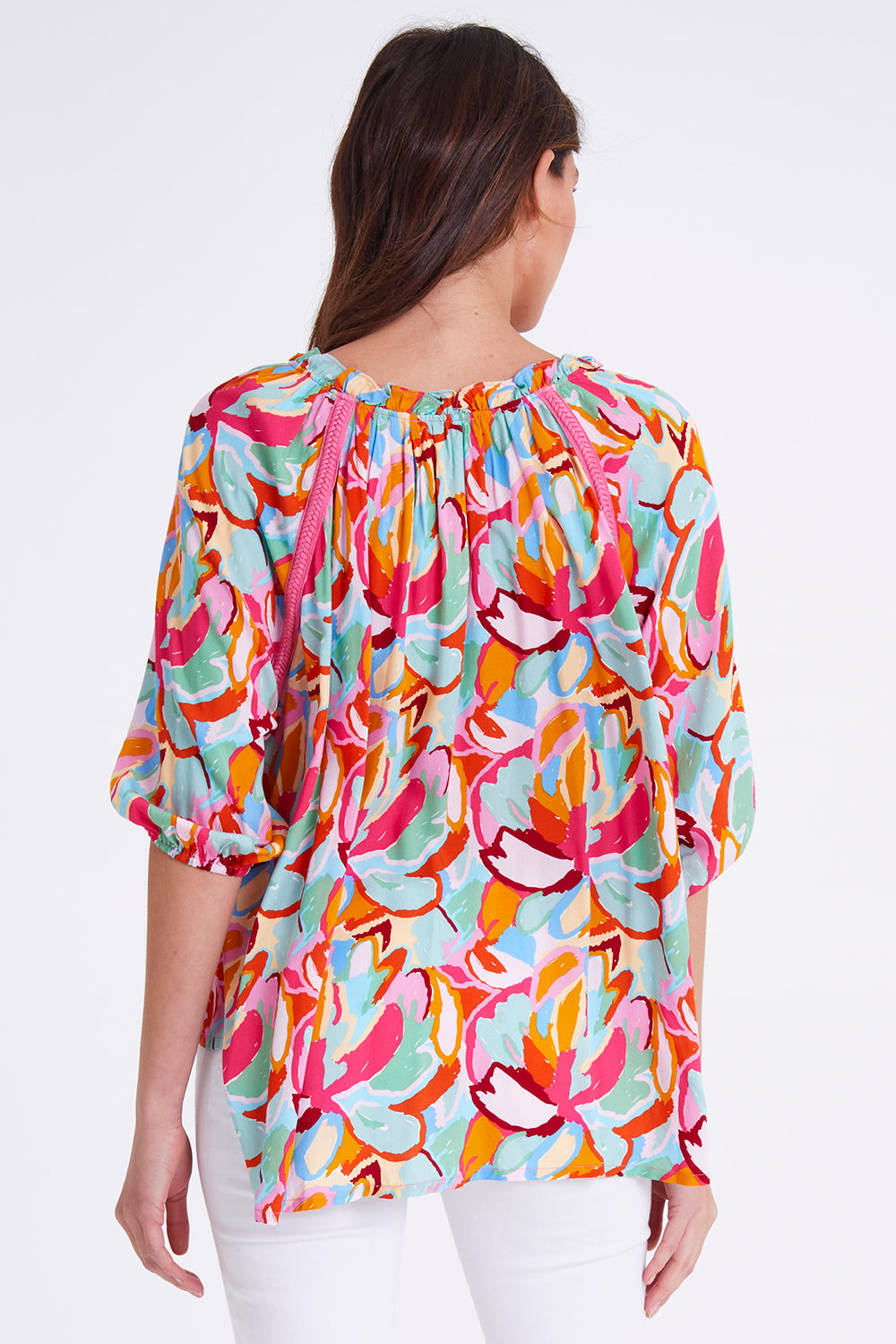 Model Madeline wearing size S of the Monet Top in colour Multi (Pink), from the back