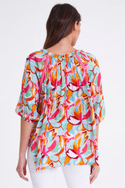 Model Madeline wearing size S of the Monet Top in colour Multi (Pink), from the back
