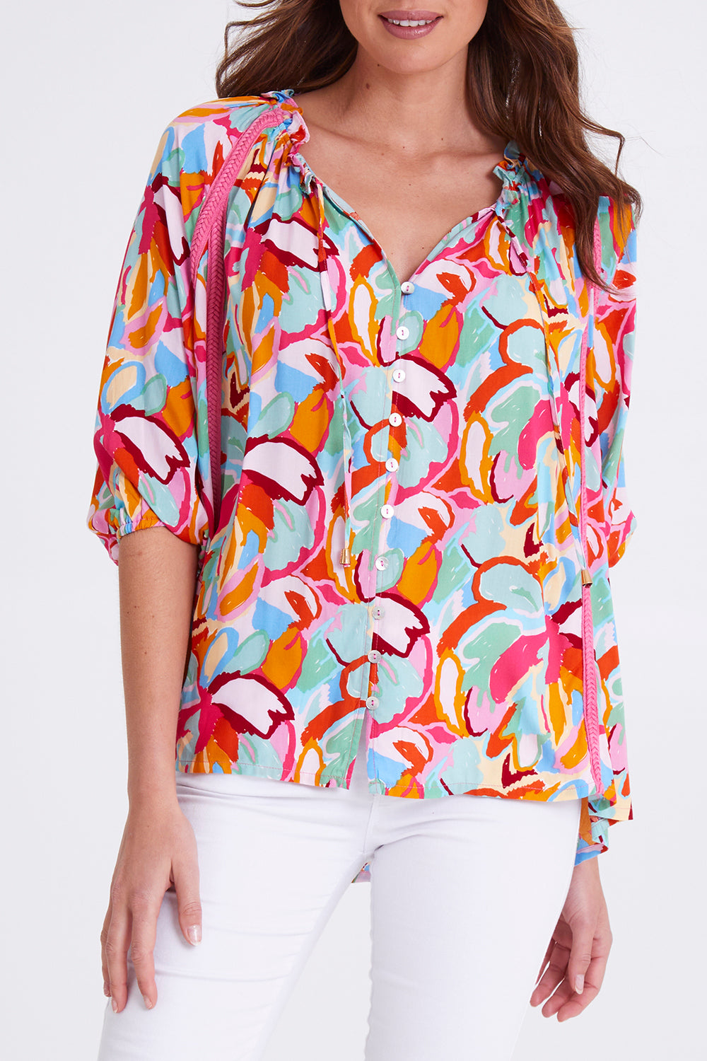 Model Madeline wearing size S of the Monet Top in colour Multi (Pink), from the front, cropped image