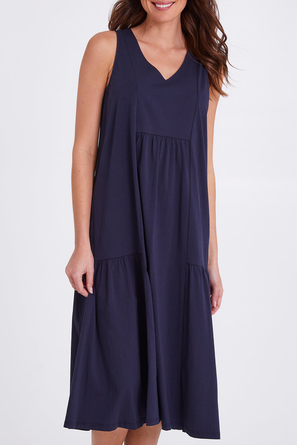 Model Madeline wearing size S of the Veuve Cotton Dress in colour Navy (Blue), from the front, cropped image