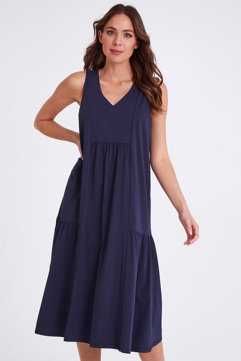 Model Madeline wearing size S of the Veuve Cotton Dress in colour Navy (Blue), from the front, cropped image