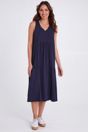 Model Madeline wearing size S of the Veuve Cotton Dress in colour Navy (Blue), from the front, showing the whole outfit