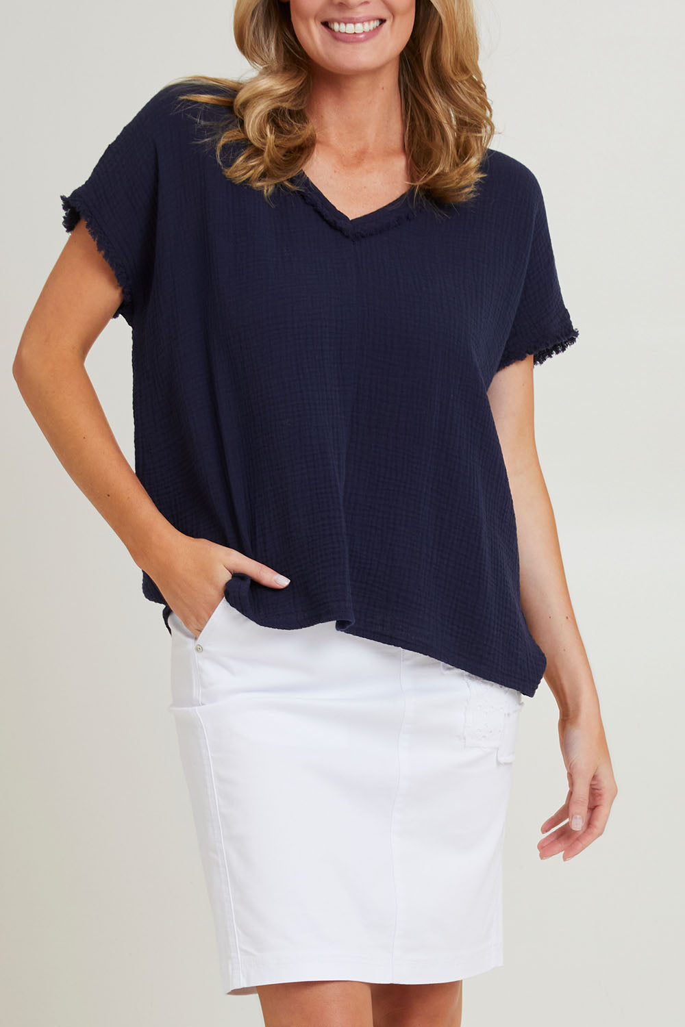 Model Grace wearing size S of the Byron Cotton Top in colour Navy (Blue), from the front, cropped image