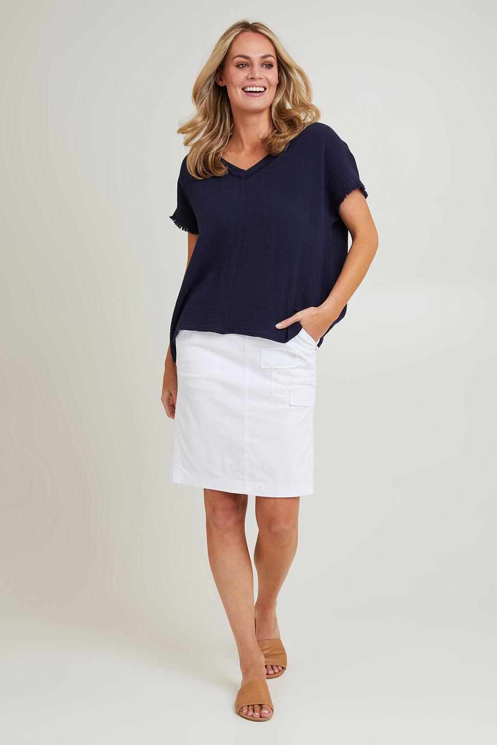 Model Grace wearing size S of the Byron Cotton Top in colour Navy (Blue), from the front, showing the whole outfit