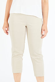 Model Shadae wearing size S of the Zara Pant in colour Natural, from the front, cropped image