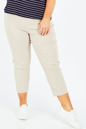 Model Stacey wearing size XL of the Zara Pant in colour Natural, from the front, cropped image