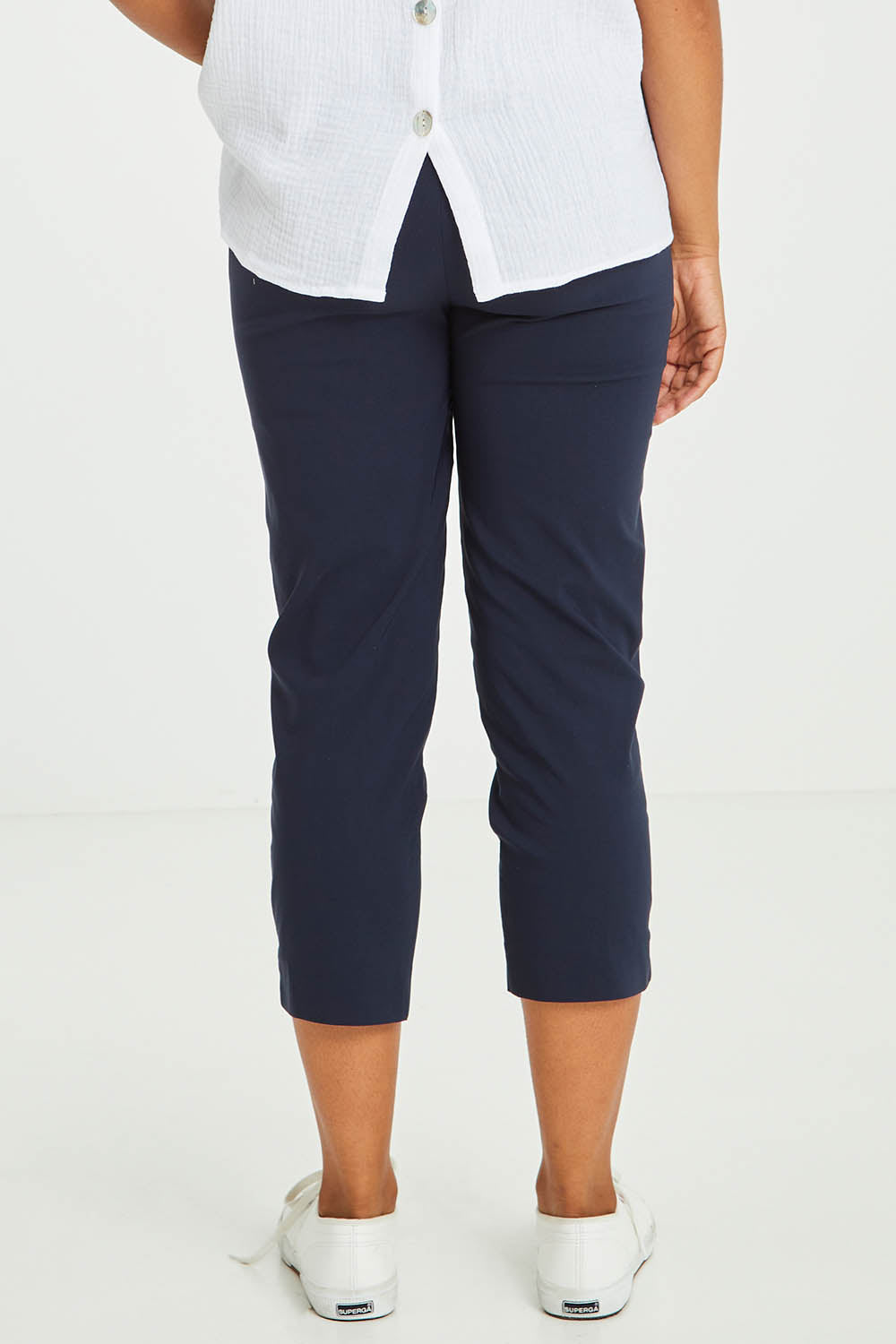 Model Olivia wearing size S of the Zara Pant in colour Navy (Blue), from the back