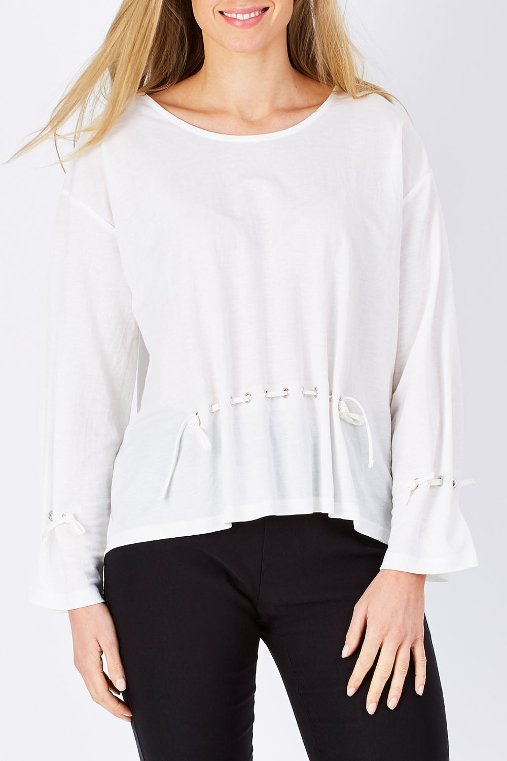 Model Maddy wearing size S of the Front Thread Top in colour White (White), from the front, cropped image