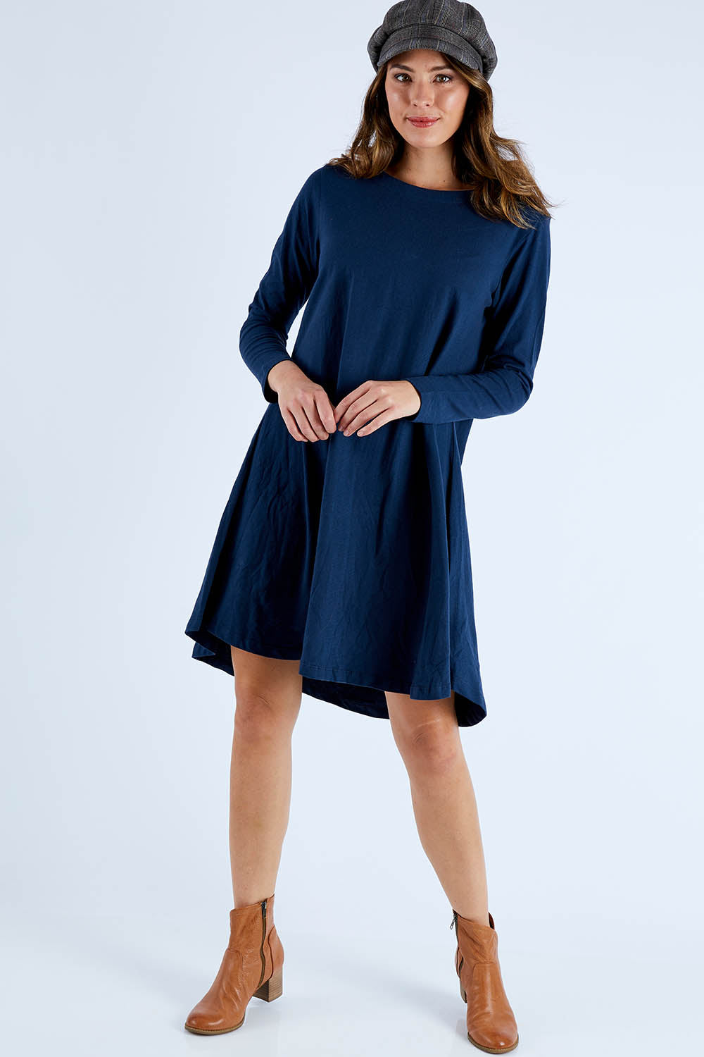 Model Madeline wearing size S of the Pleat Back Dress in colour Ocean (Blue), from the front, showing the whole outfit