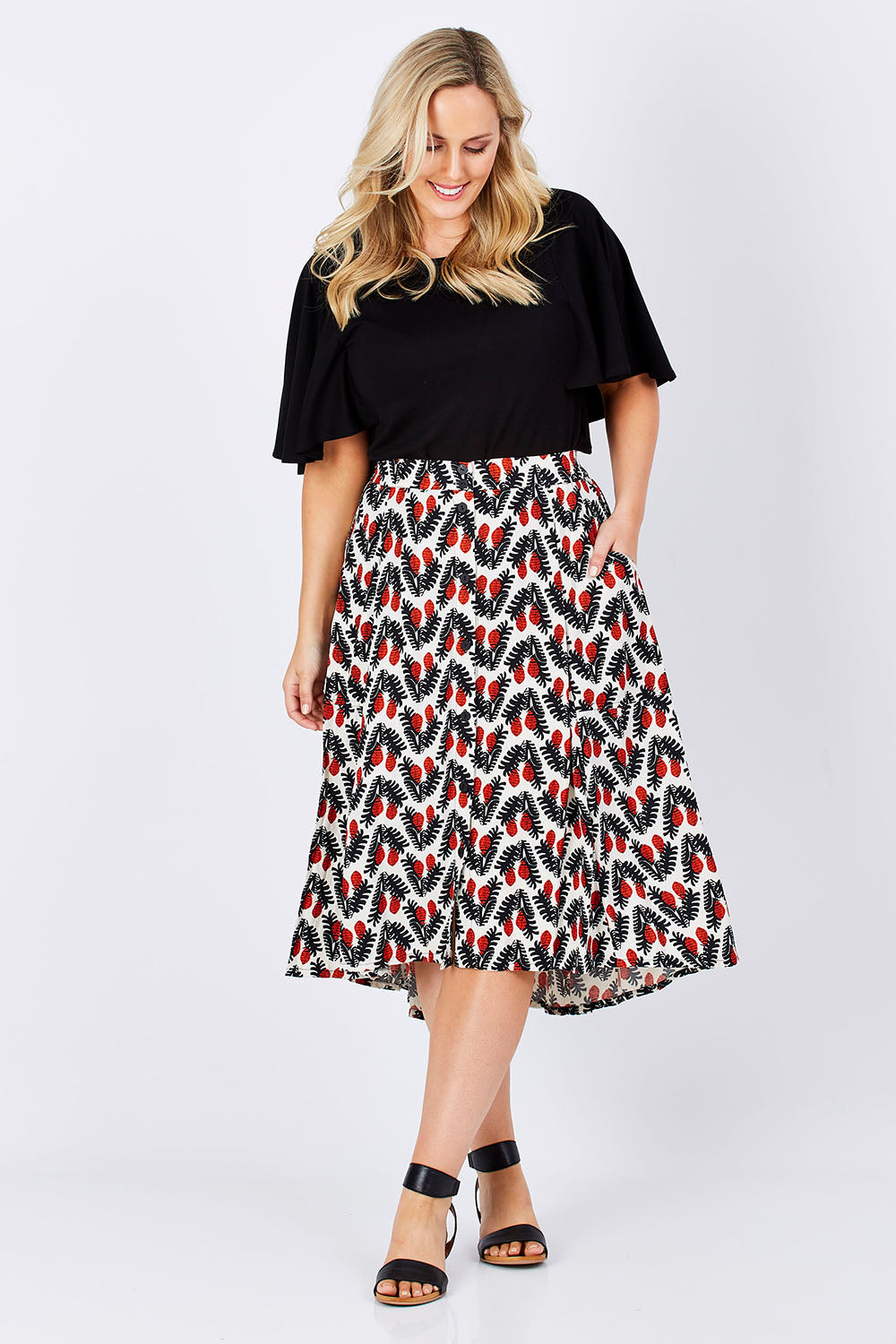 Model Jess wearing the Ayna Skirt in colour BayamCream, from the front, showing the whole outfit