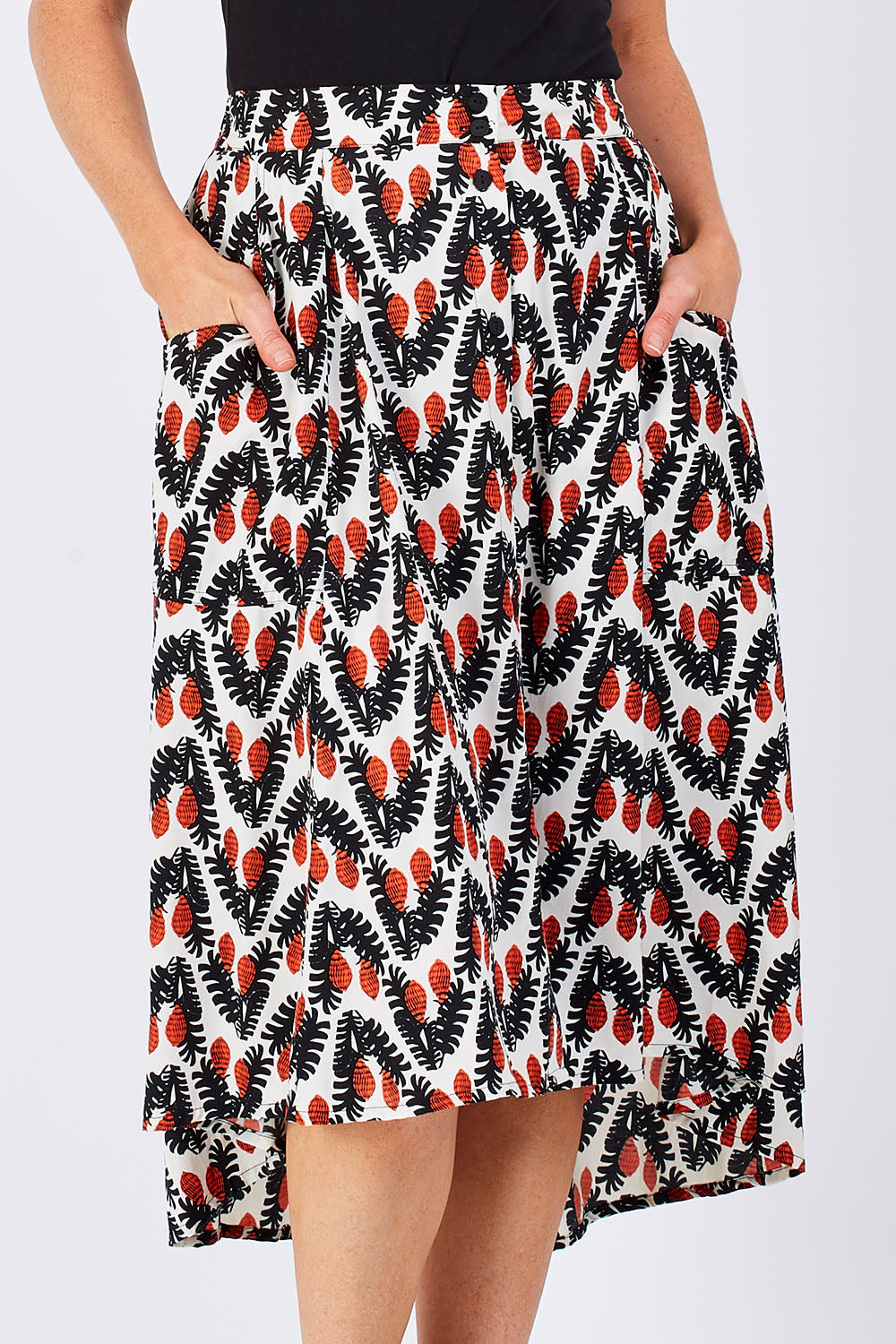 Model Katie wearing the Ayna Skirt in colour BayamCream, from the front, cropped image
