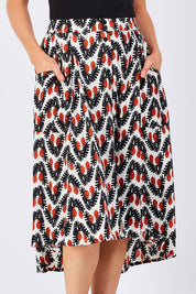 Model Katie wearing the Ayna Skirt in colour BayamCream, from the front, cropped image