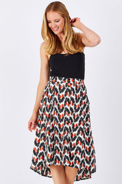 Model Katie wearing the Ayna Skirt in colour BayamCream, from the front, cropped image