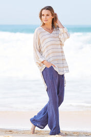 Model Nathalie wearing size S of the Monte Pant in colour Navy (Blue), from the front, showing the whole outfit