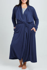 Model Poppy wearing the Jersey Wrap Maxi Cardi in colour Denimblue (Blue), from the front, cropped image