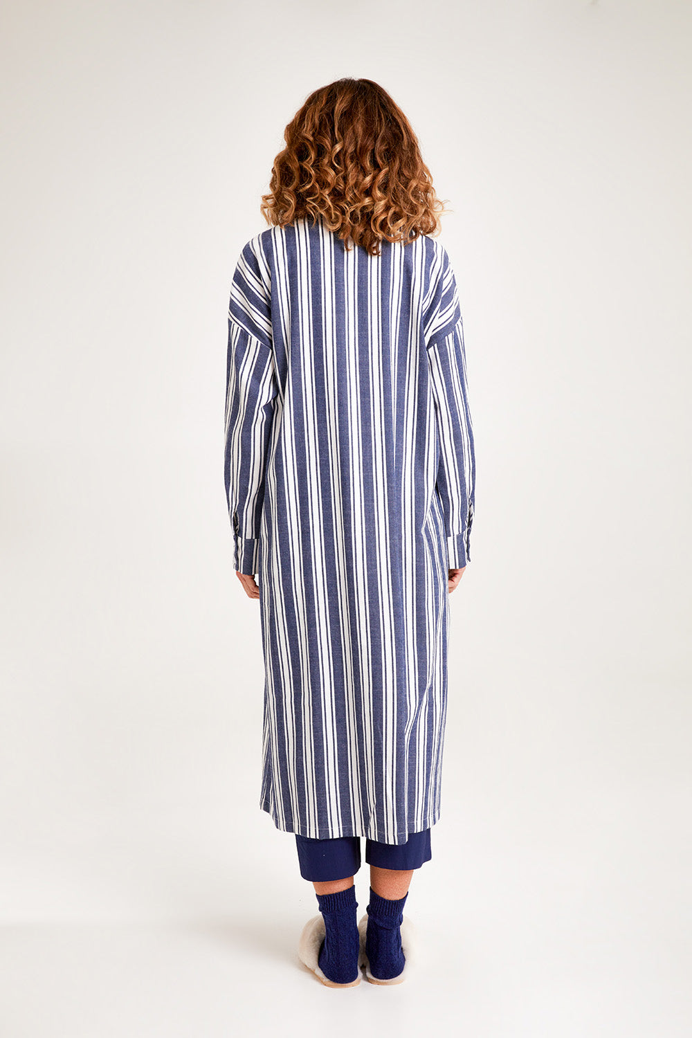 Model Emma wearing the Oversized Cotton Linen Sleep Shirt in colour Navystripe (Blue), from the back