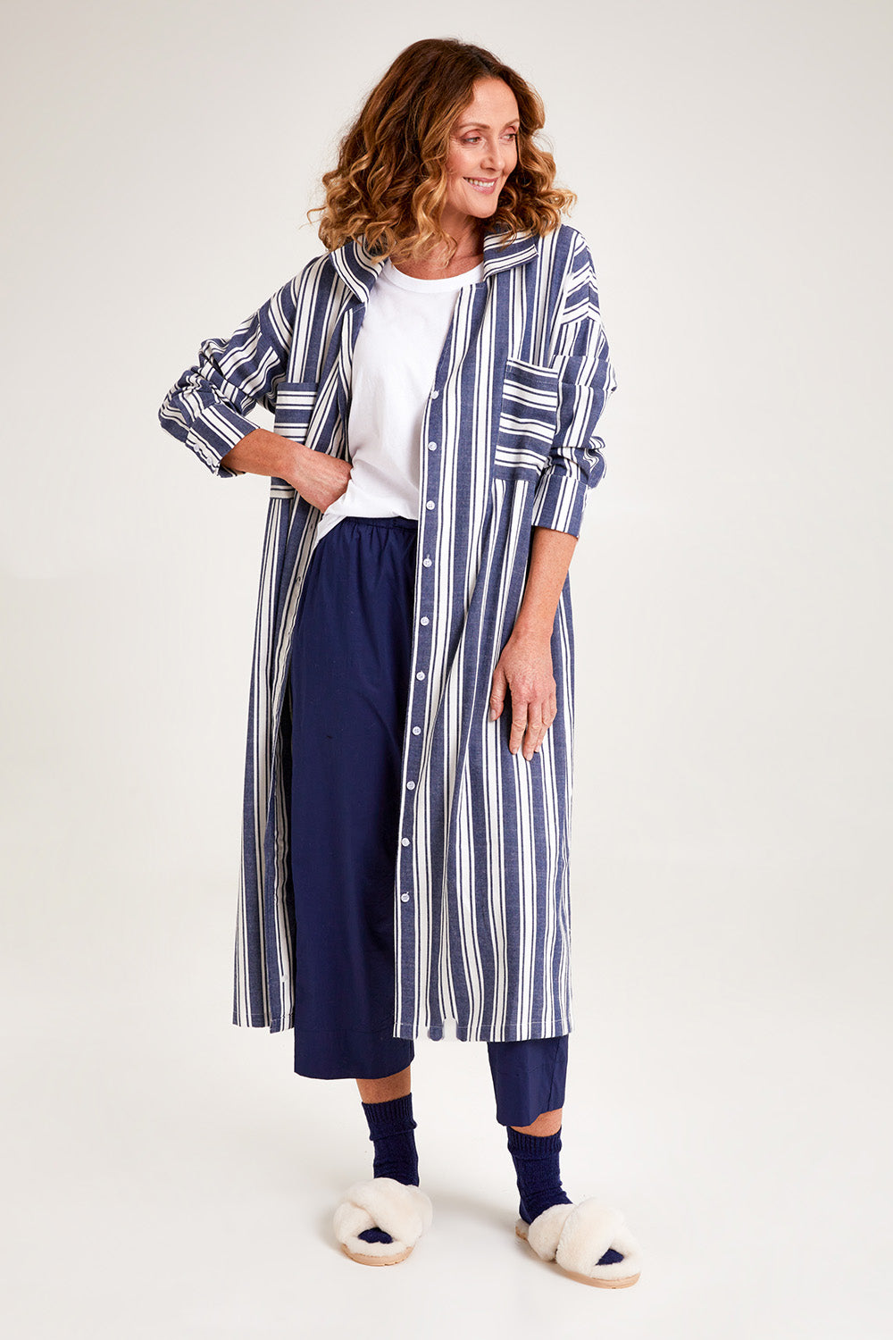 Model Emma wearing the Oversized Cotton Linen Sleep Shirt in colour Navystripe (Blue), from the front, showing the whole outfit