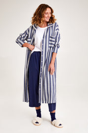 Model Emma wearing the Oversized Cotton Linen Sleep Shirt in colour Navystripe (Blue), from the front, showing the whole outfit
