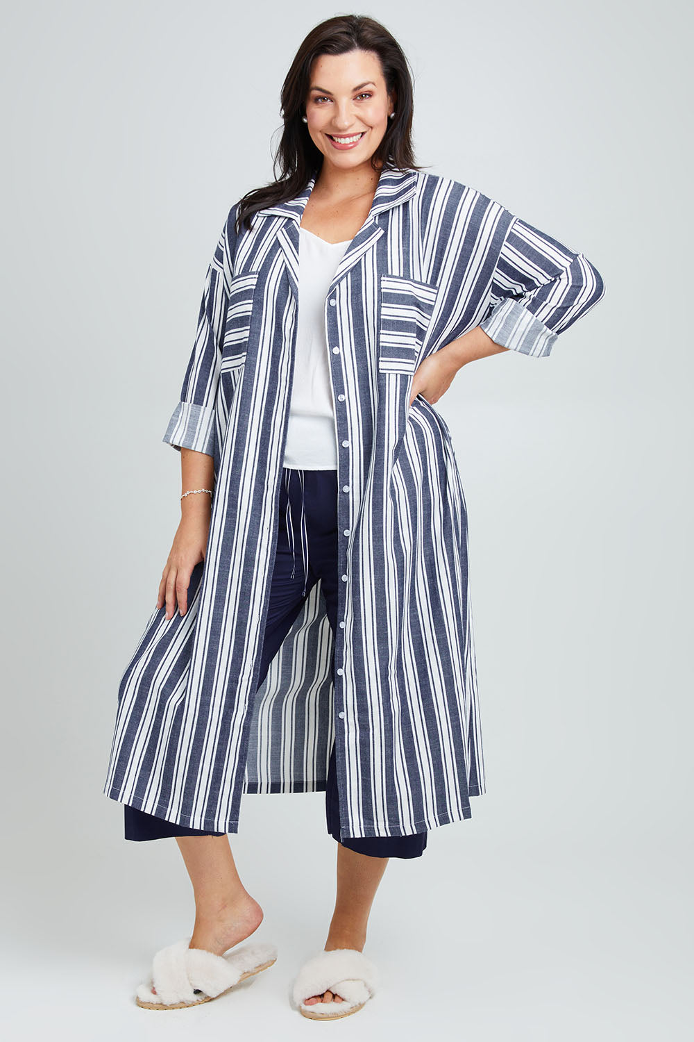 Model Poppy wearing the Oversized Cotton Linen Sleep Shirt in colour Navystripe (Blue), from the front, showing the whole outfit