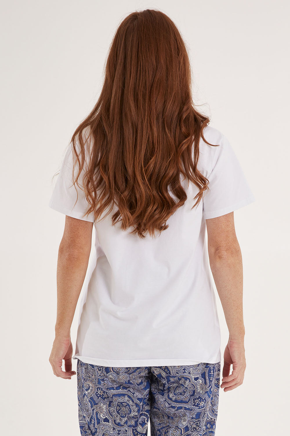 Model Sally wearing the Cotton Jersey V Neck Tee in colour White (White), from the back