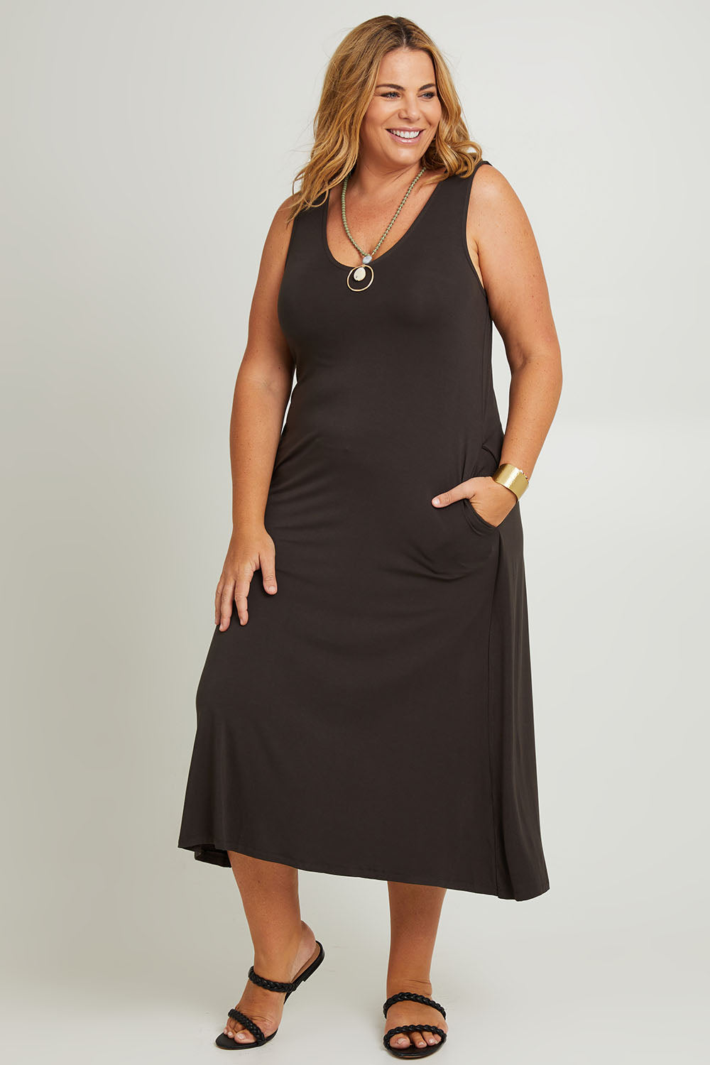 Model Fiona wearing the Modal Back Wrap Midi Dress in colour Deepgreen (Green), from the front, showing the whole outfit