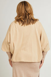 Model Fiona wearing the Cotton Terry Batwing Sweater in colour Porridge, from the back