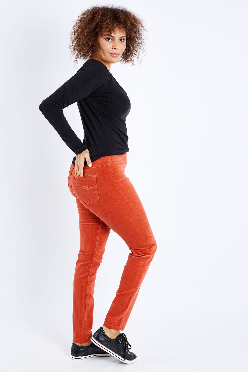 Model Lala wearing size 10 of the Skinny Leg Cord Pull On Pant in colour Auburn, from the front, showing the whole outfit