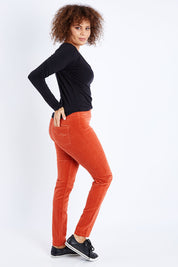 Model Lala wearing size 10 of the Skinny Leg Cord Pull On Pant in colour Auburn, from the front, showing the whole outfit