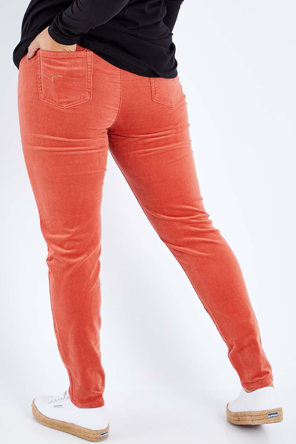 Model Sasha-Lee wearing size 16 of the Skinny Leg Cord Pull On Pant in colour Auburn, from the back