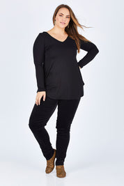 Model Sophie wearing size 14 of the Skinny Leg Cord Pull On Pant in colour Black (Black), from the front, showing the whole outfit