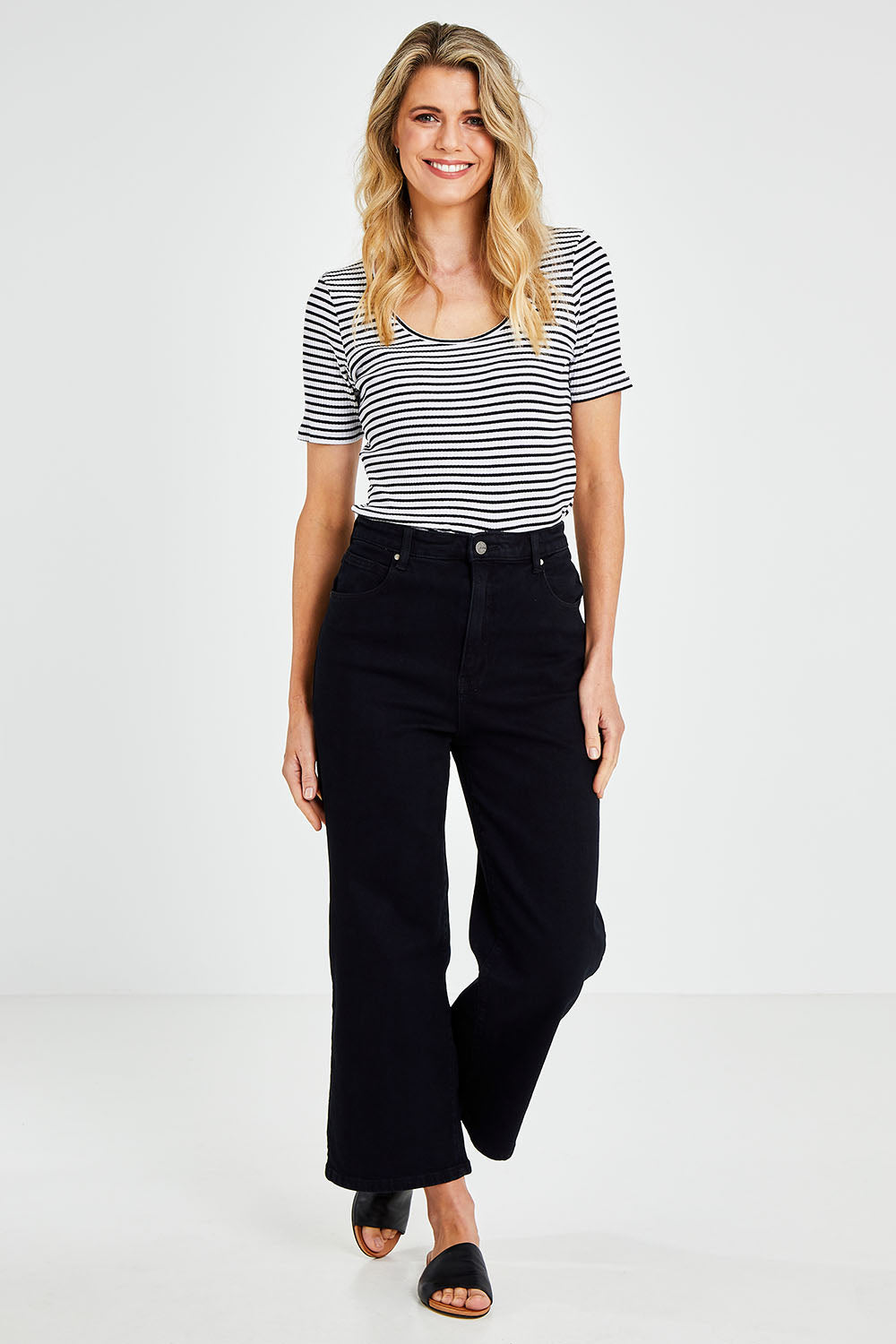 Model Kelly wearing size 10 of the Steph High Rise Wide Leg Jean in colour Black (Black), from the front, showing the whole outfit