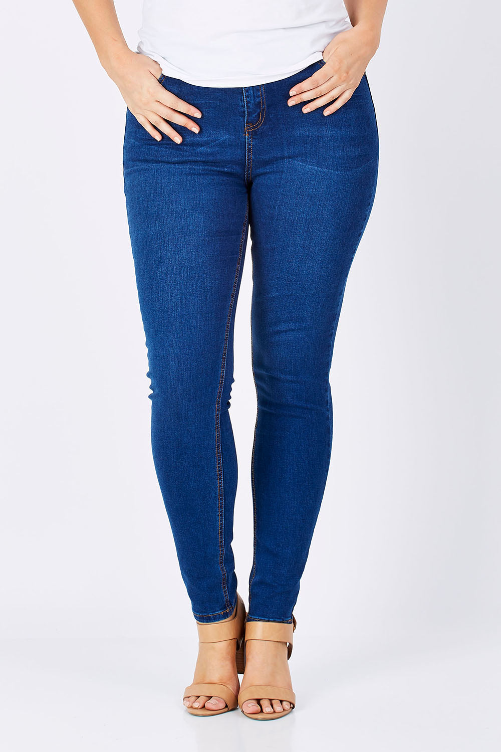 Model Jess wearing size 14 of the Diana Skinny in colour Denim (Blue), from the front, cropped image