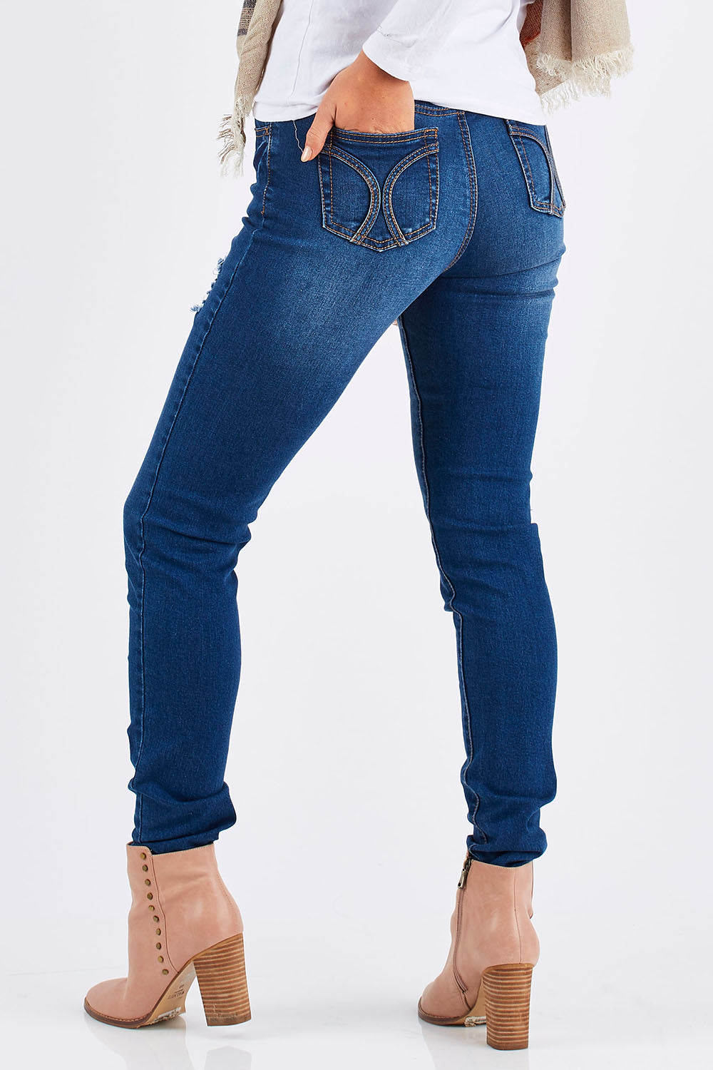 Model Chesska wearing size 10 of the Nova Skinny in colour Denim (Blue), from the back